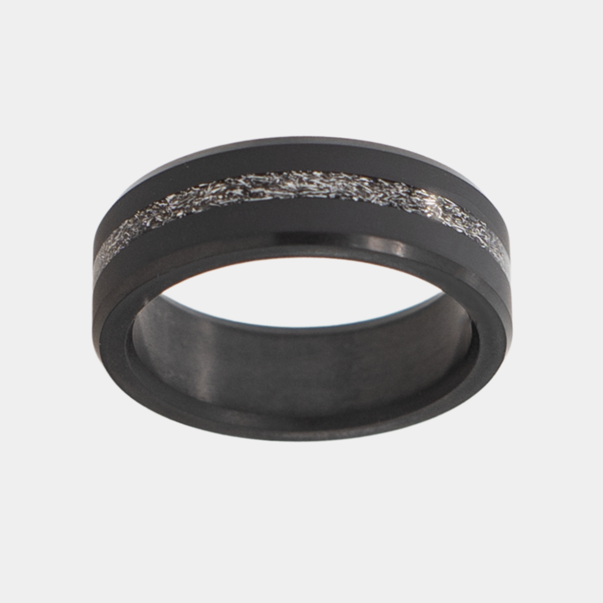 Solid Black Diamond ring with Meteorite Inlay on a light gray background