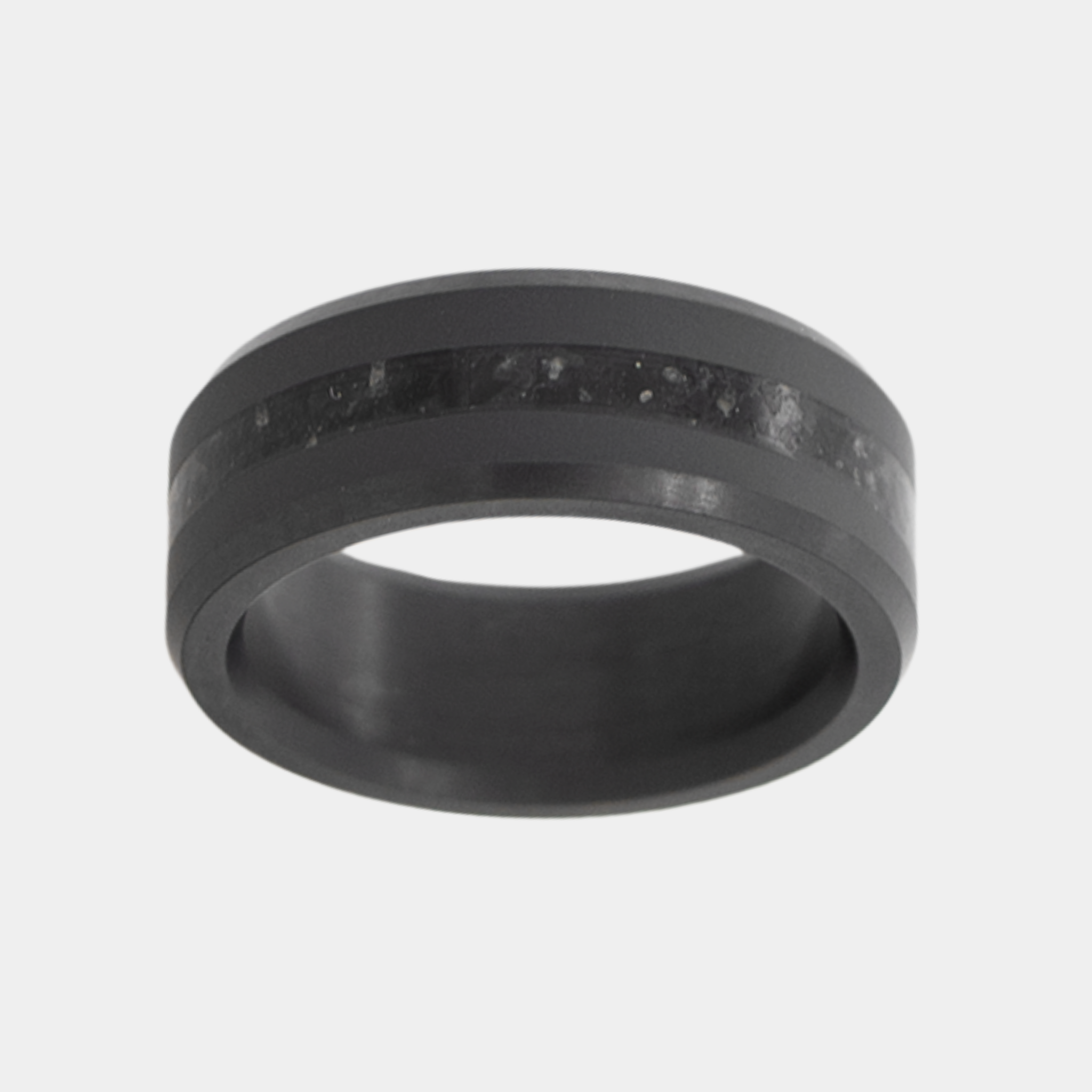 Solid Black Diamond ring with obsidian inlay on a light gray background