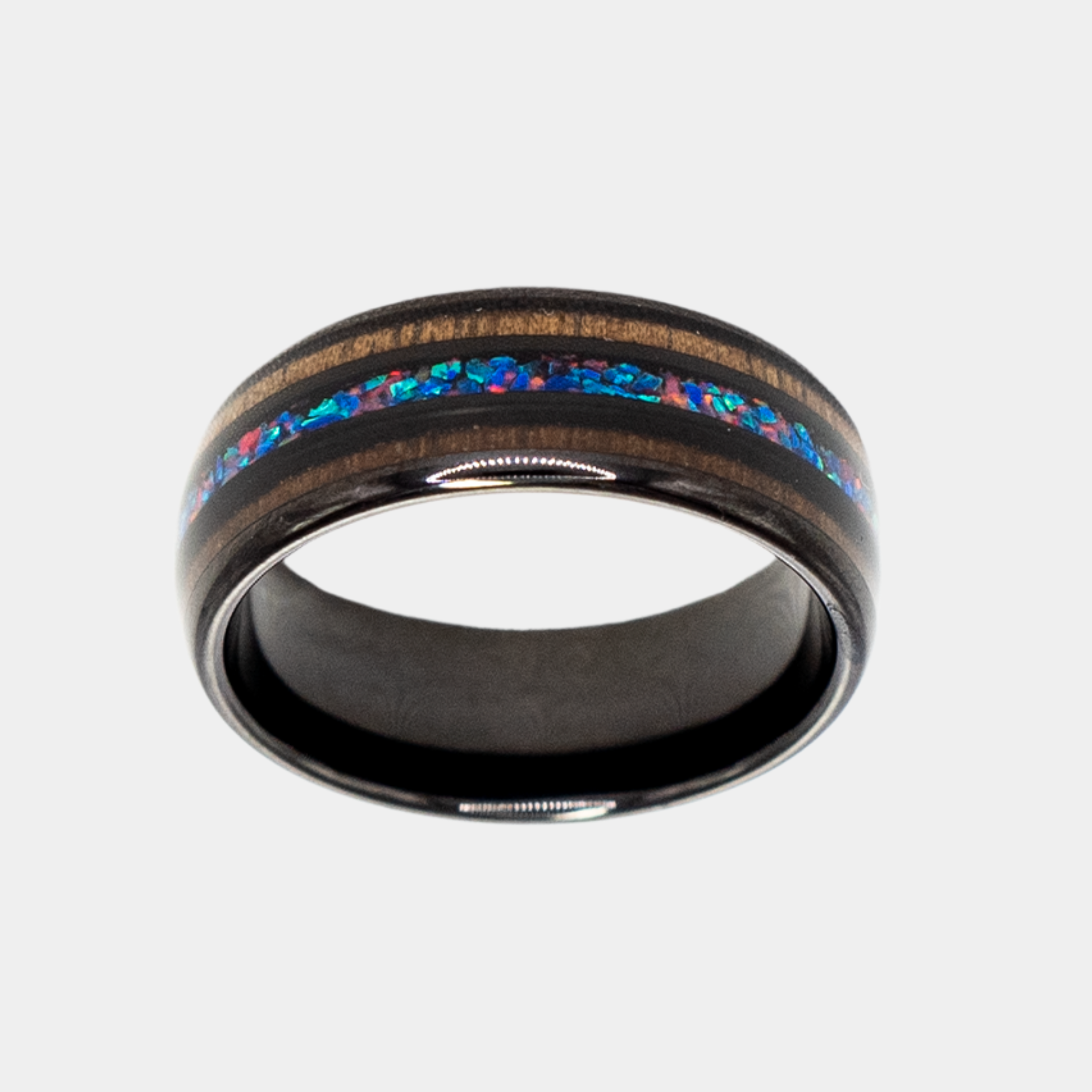 Nereus ring – solid black diamond with polished beveled edges from the Hustler Collection. Top-down view showcasing ring face.