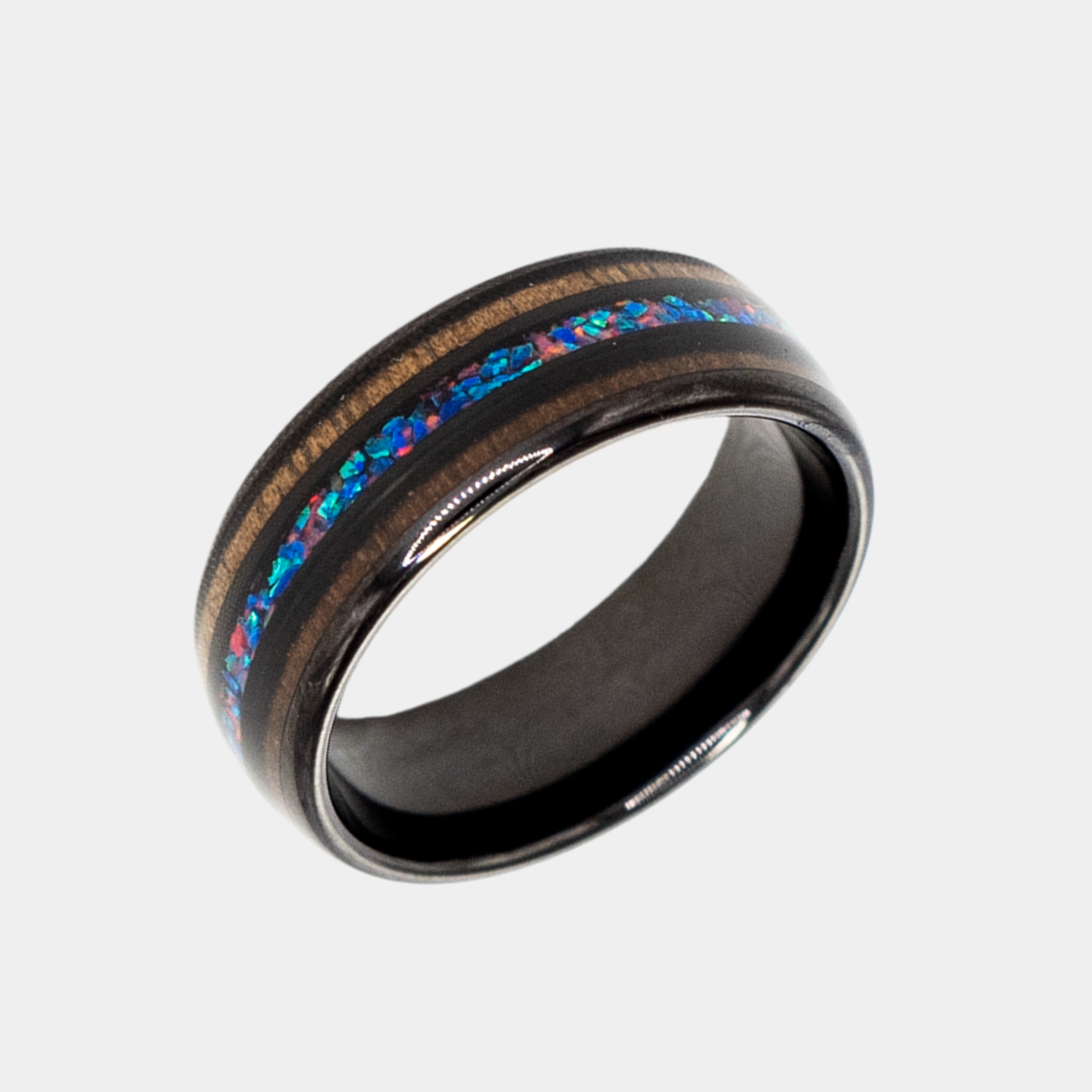 Nereus ring – solid black diamond with polished beveled edges from the Hustler Collection. Angled view highlighting shape and finish.