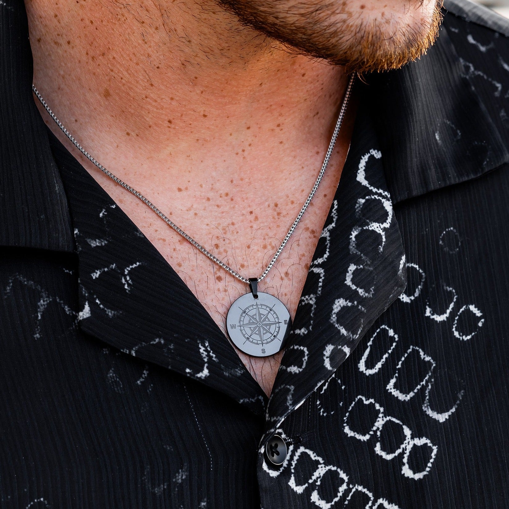 Lifestyle shot #2 of man wearing our Elysium Men's Black Diamond Necklance & 26mm Custom Pendant with Silver Franco Chain | ElysiumBlack.com | Men's Black Diamond Silver Chain